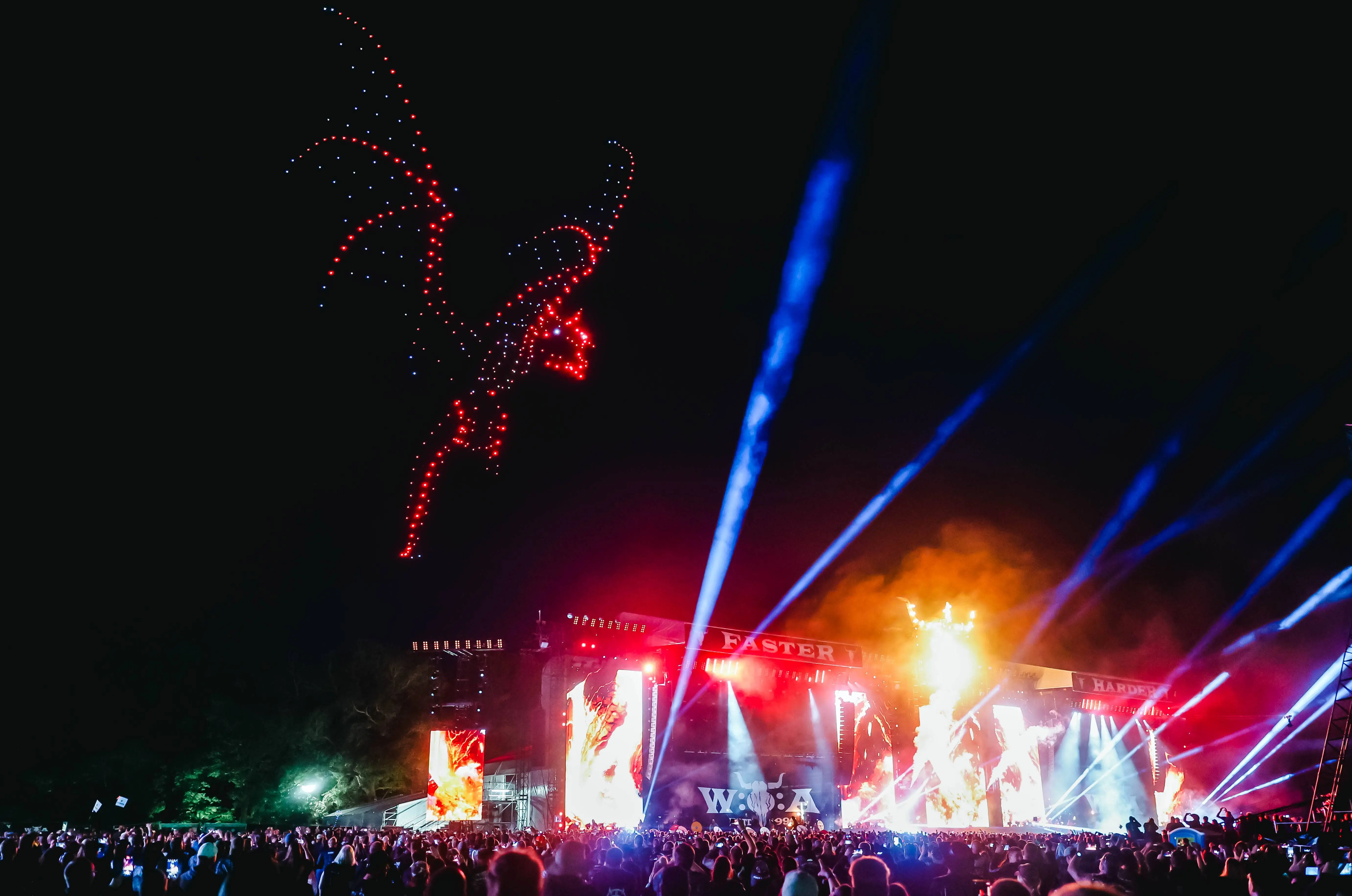 Drones in a formation of a Dragon over the crowd